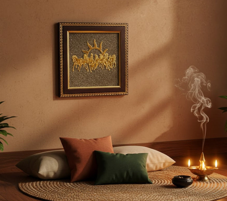 Meditation room with cushions, candles, and a framed artwork on a wall.